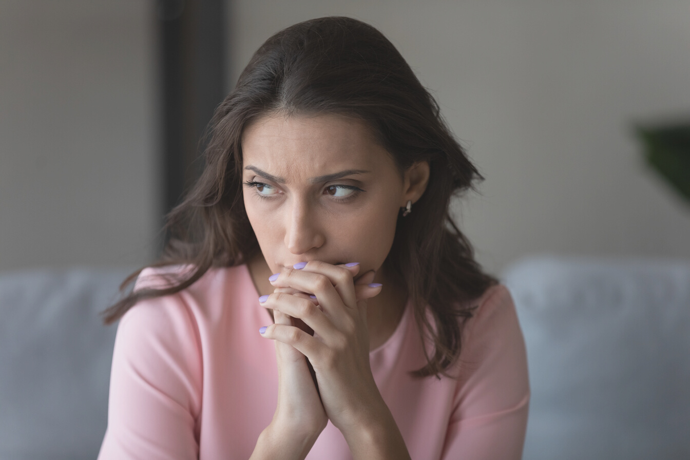 Worried Woman Looking Away and Contemplating 