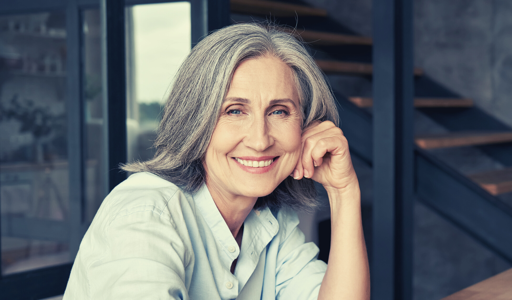 Mature Middle Aged Woman Sitting at Workplace